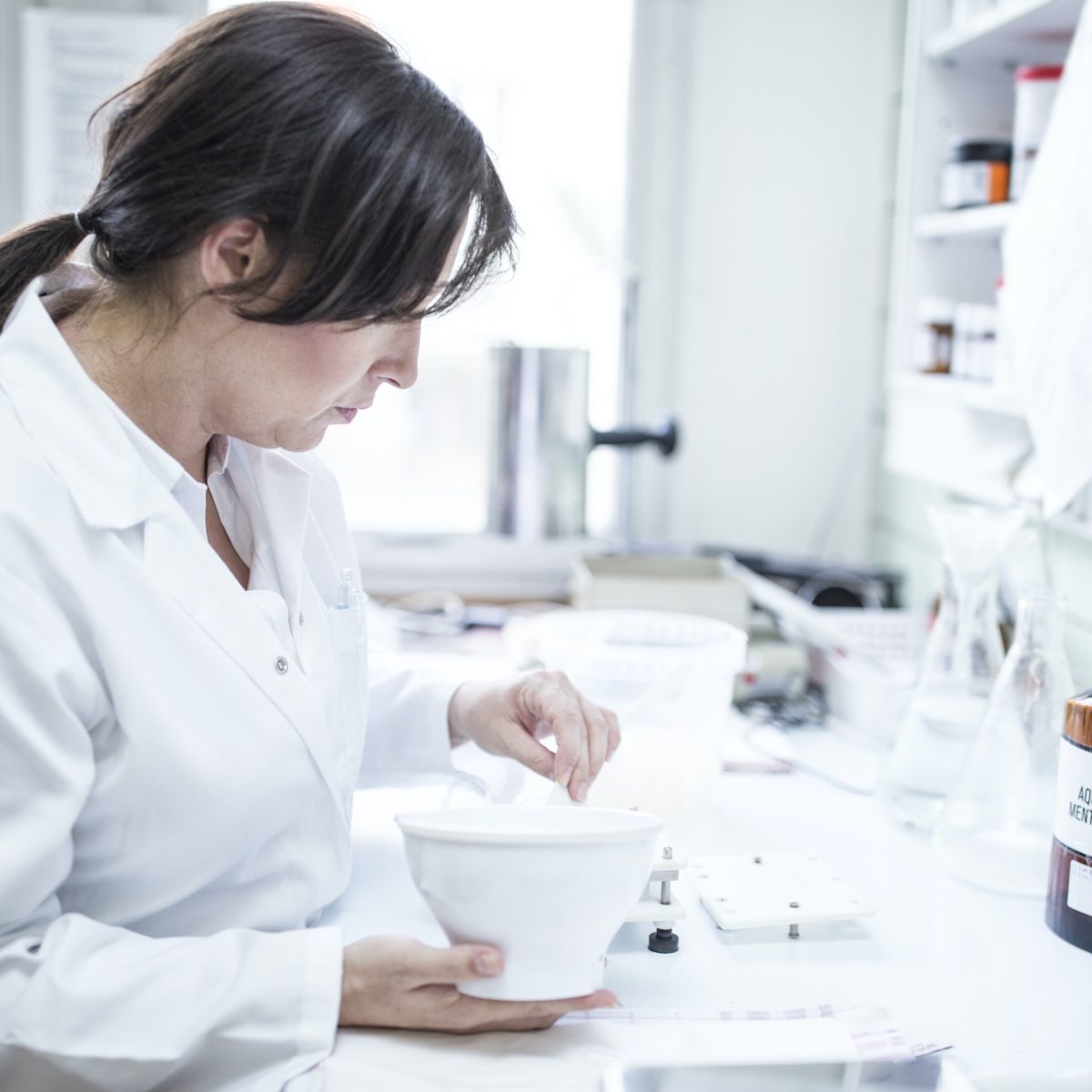 woman-preparing-medicine-in-laboratory-of-a-pharmacy.jpg